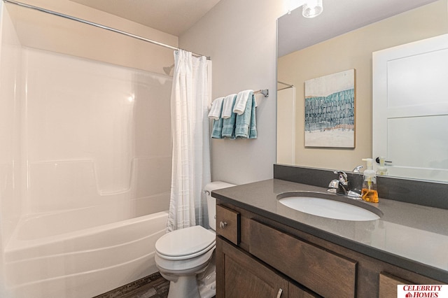 bathroom featuring toilet, shower / bath combo, wood finished floors, and vanity