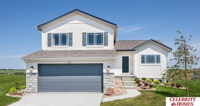 view of front facade with a shingled roof, a garage, and stone siding