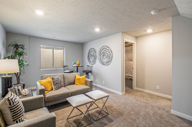living room with recessed lighting, baseboards, carpet floors, and a textured ceiling