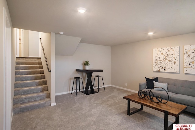 carpeted living area with stairway, recessed lighting, and baseboards