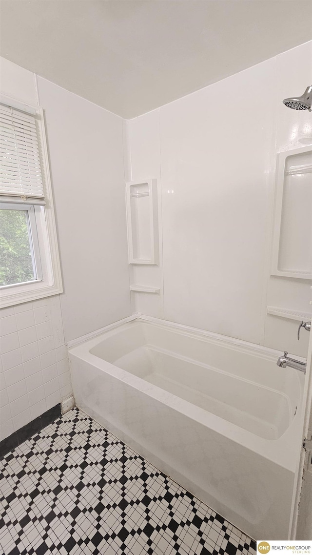 bathroom featuring tile patterned floors and tub / shower combination