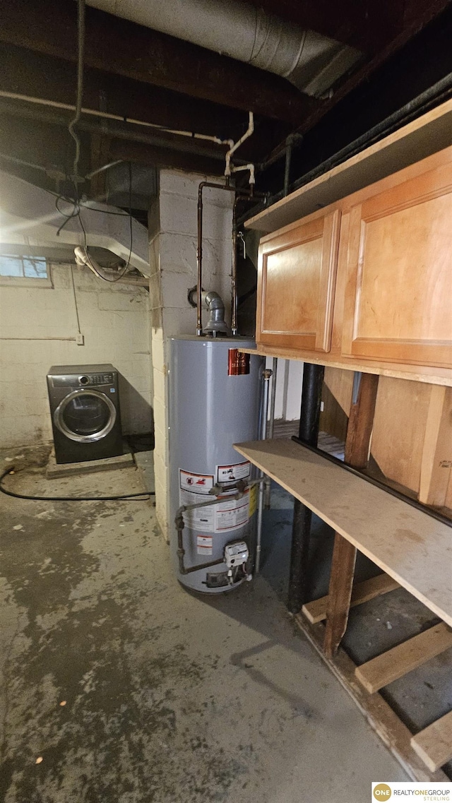 unfinished basement with water heater and washer / dryer