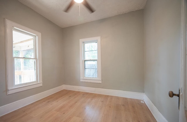 616 N 4th St, Beatrice, NE 68310 - unfurnished room featuring light wood-style flooring, baseboards, and ceiling fan