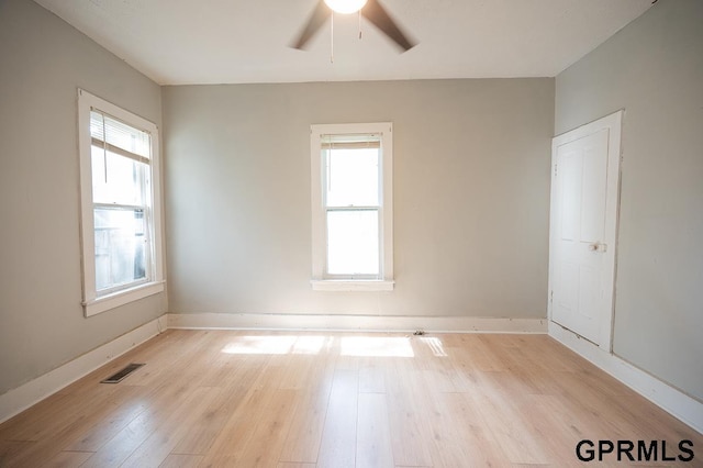 616 N 4th St, Beatrice, NE 68310 - unfurnished room with plenty of natural light, light wood-style floors, a ceiling fan, and baseboards