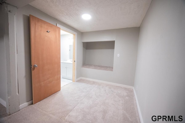616 N 4th St, Beatrice, NE 68310 - carpeted empty room featuring a textured ceiling and baseboards
