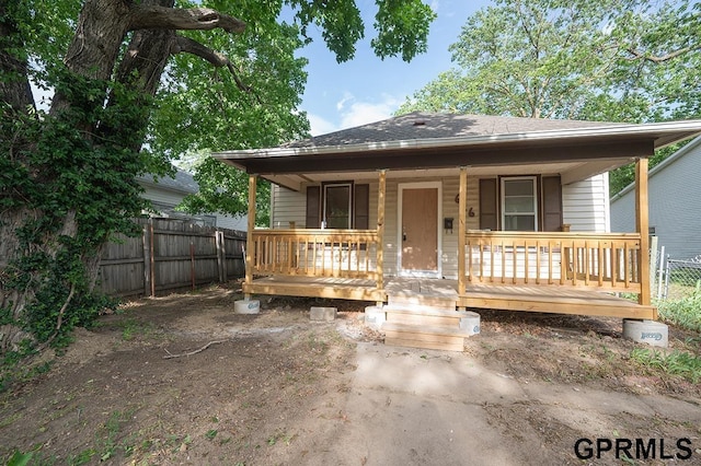 616 N 4th St, Beatrice, NE 68310 - view of front facade with covered porch and a shingled roof