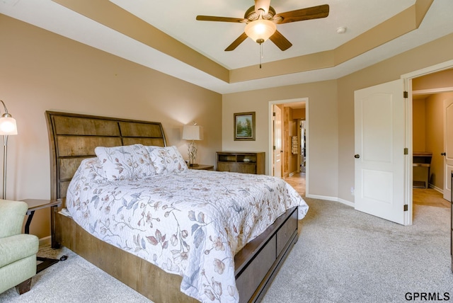 7320 S 169th St, Omaha, NE 68136 - bedroom featuring light colored carpet, baseboards, a raised ceiling, and ceiling fan