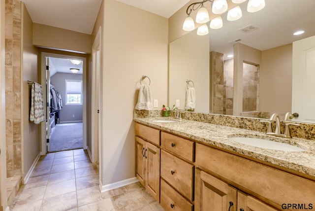 7320 S 169th St, Omaha, NE 68136 - bathroom featuring double vanity, baseboards, and tile patterned floors