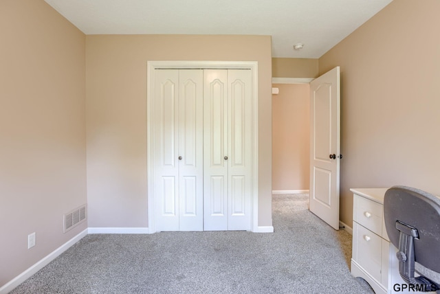 7320 S 169th St, Omaha, NE 68136 - unfurnished bedroom featuring light colored carpet, a closet, baseboards, and a desk
