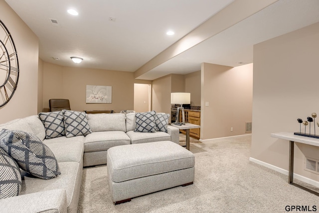 7320 S 169th St, Omaha, NE 68136 - living area featuring light colored carpet, baseboards, and recessed lighting