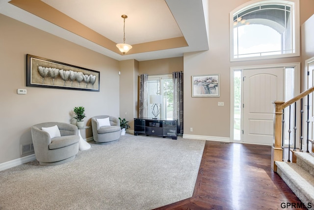 7320 S 169th St, Omaha, NE 68136 - foyer featuring baseboards, stairs, and dark wood-style floors