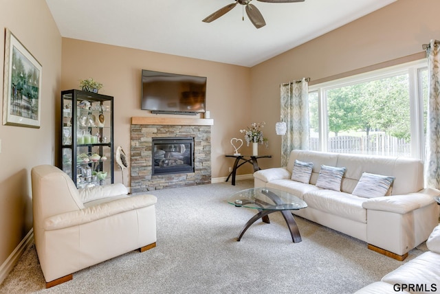 7320 S 169th St, Omaha, NE 68136 - carpeted living room with ceiling fan, baseboards, and a fireplace