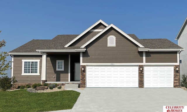 craftsman inspired home featuring an attached garage, driveway, a front lawn, and roof with shingles