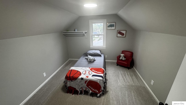 bedroom featuring vaulted ceiling, carpet flooring, and baseboards