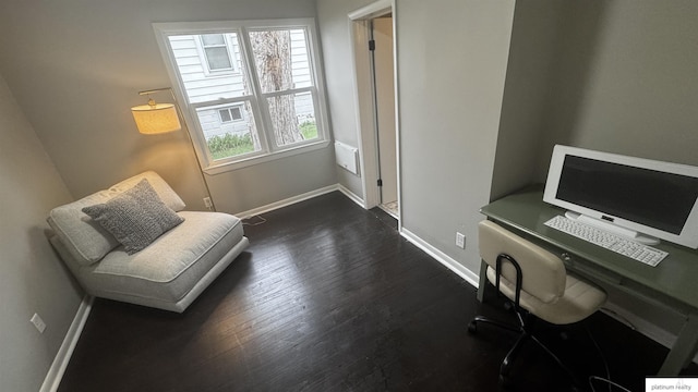 office space featuring baseboards and dark wood-type flooring