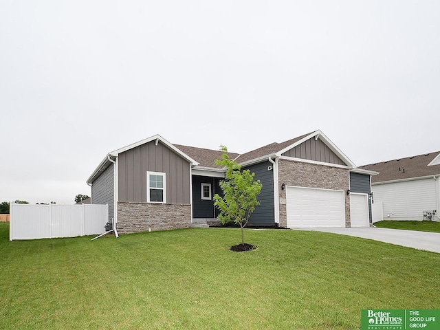 view of front of home featuring board and batten siding, stone siding, a garage, and driveway