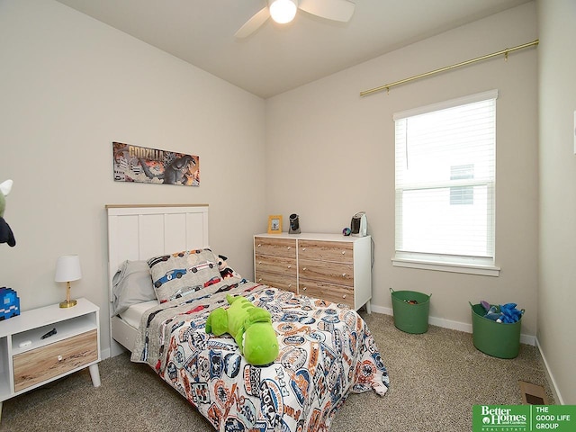 carpeted bedroom with baseboards and a ceiling fan