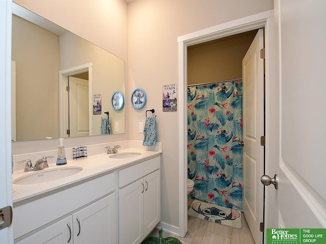bathroom featuring double vanity, tile patterned flooring, a shower with shower curtain, and toilet