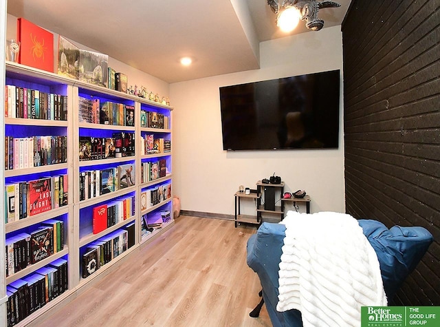 living area featuring wood finished floors and baseboards