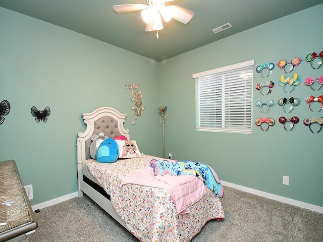 carpeted bedroom featuring baseboards and ceiling fan