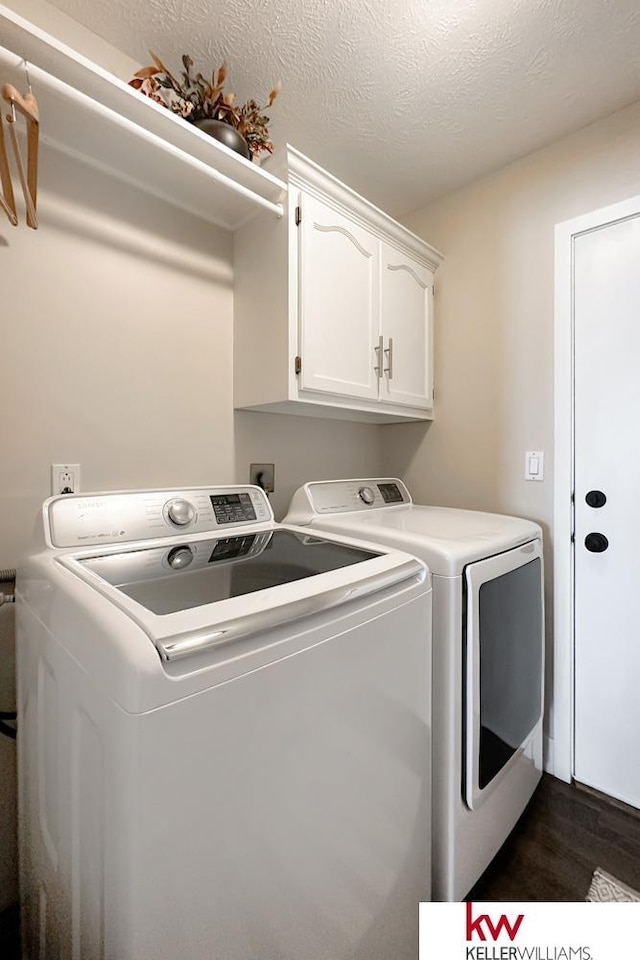 7815 Maui Cir, Papillion, NE 68046 - washroom with washing machine and dryer, cabinet space, and dark wood-type flooring
