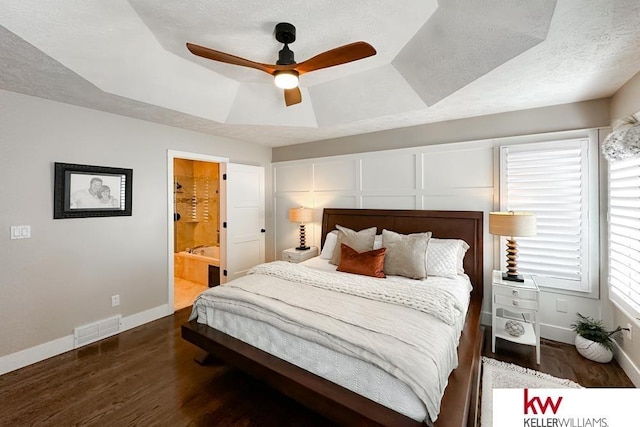 7815 Maui Cir, Papillion, NE 68046 - bedroom featuring wood finished floors, a tray ceiling, baseboards, a textured ceiling, and a ceiling fan