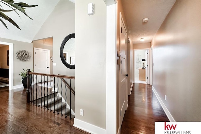 7815 Maui Cir, Papillion, NE 68046 - hall featuring dark wood-type flooring, baseboards, and lofted ceiling