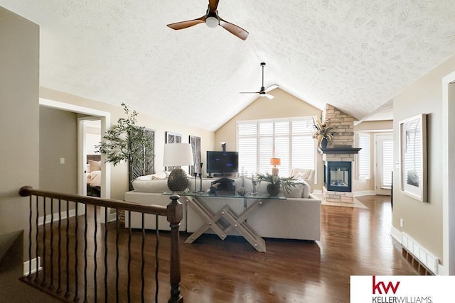 7815 Maui Cir, Papillion, NE 68046 - living area with ceiling fan, a textured ceiling, plenty of natural light, wood finished floors, and vaulted ceiling