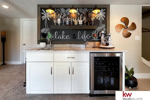 7815 Maui Cir, Papillion, NE 68046 - indoor bar featuring beverage cooler, carpet flooring, baseboards, and a textured ceiling