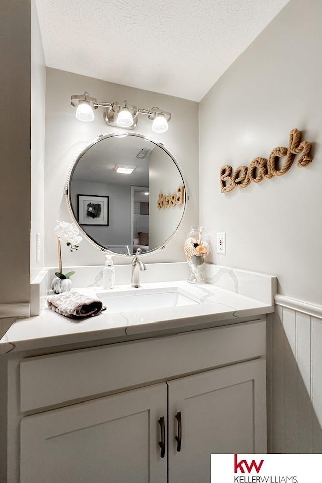 7815 Maui Cir, Papillion, NE 68046 - bathroom featuring vanity and a textured ceiling