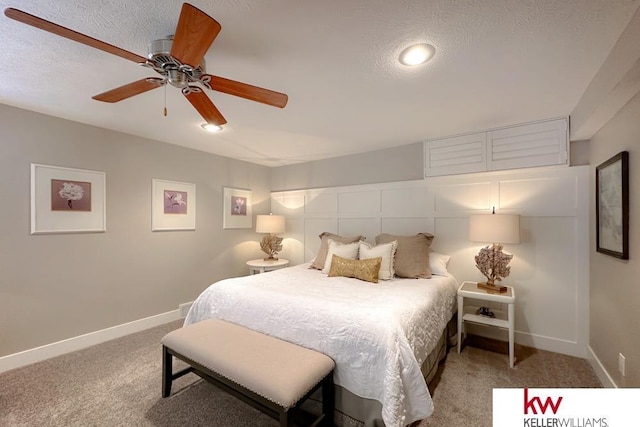 7815 Maui Cir, Papillion, NE 68046 - bedroom featuring light carpet, baseboards, a textured ceiling, and ceiling fan