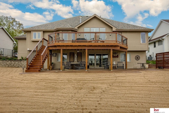 7815 Maui Cir, Papillion, NE 68046 - back of house with a wooden deck, stairway, roof with shingles, and cooling unit