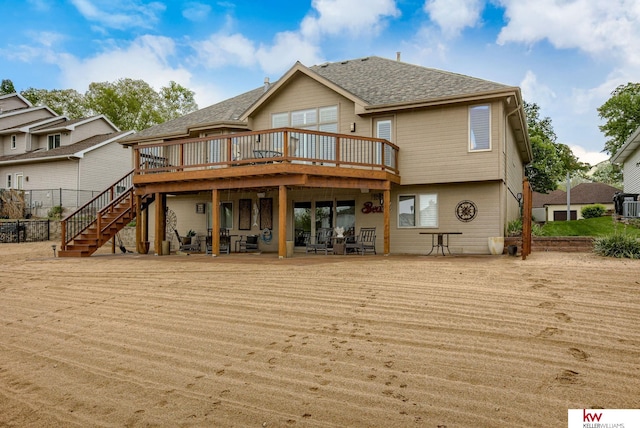7815 Maui Cir, Papillion, NE 68046 - rear view of property with a deck, stairway, and roof with shingles
