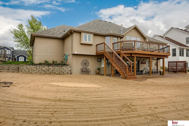 7815 Maui Cir, Papillion, NE 68046 - rear view of house featuring a wooden deck, stairs, and roof with shingles