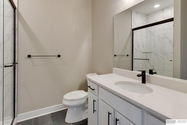 1917 Dahlman Rows Plz, Omaha, NE 68108 - full bathroom with tile patterned floors, baseboards, a shower stall, toilet, and vanity