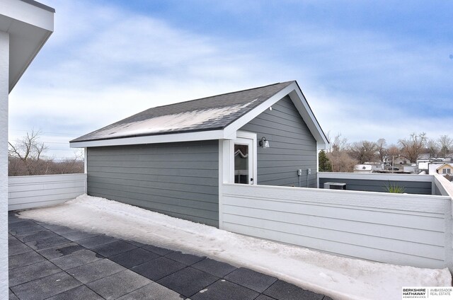 1917 Dahlman Rows Plz, Omaha, NE 68108 - view of home's exterior featuring a shingled roof