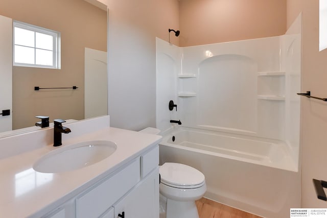 1921 Dahlman Rows Plz, Omaha, NE 68108 - full bath featuring toilet, shower / tub combination, vanity, and wood finished floors