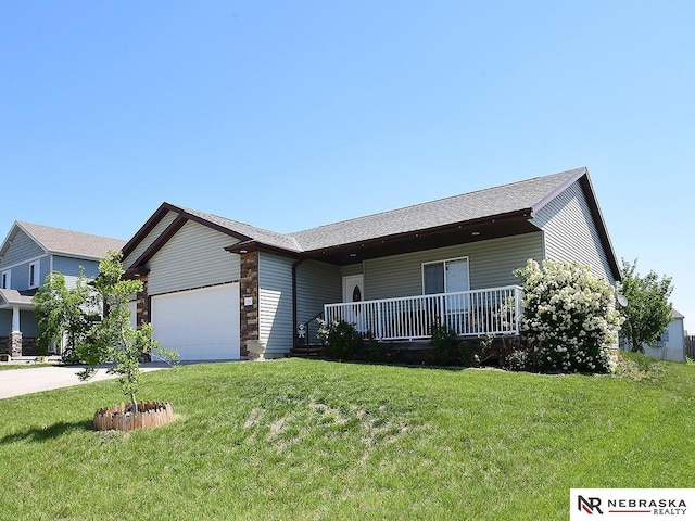 70 Switchgrass Ln, Bennet, NE 68317 - ranch-style home featuring a porch, a front yard, an attached garage, and concrete driveway