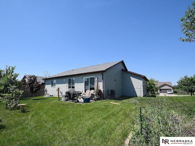 70 Switchgrass Ln, Bennet, NE 68317 - back of house with a yard, a patio area, and central AC