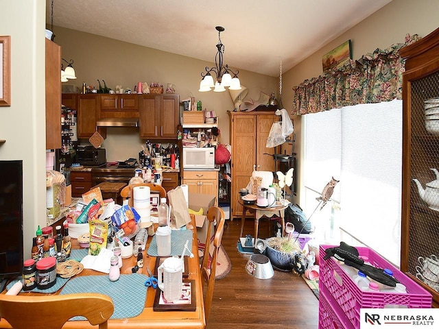 70 Switchgrass Ln, Bennet, NE 68317 - dining room featuring a chandelier and dark wood finished floors