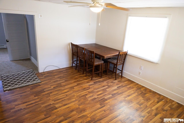547 I St, Pawnee City, NE 68420 - dining space featuring ceiling fan, wood finished floors, baseboards, and a baseboard heating unit