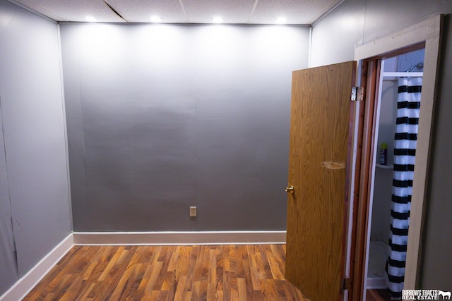 547 I St, Pawnee City, NE 68420 - unfurnished room featuring baseboards, wood finished floors, a paneled ceiling, and recessed lighting