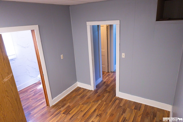 547 I St, Pawnee City, NE 68420 - spare room with dark wood-type flooring and baseboards