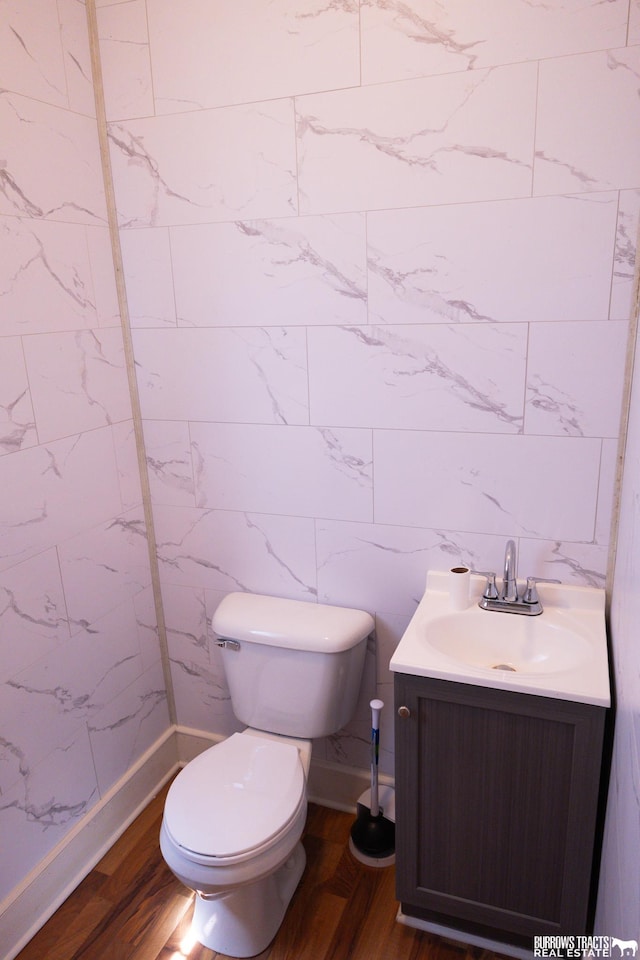 547 I St, Pawnee City, NE 68420 - half bath with vanity, toilet, and wood finished floors