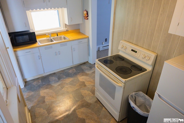 547 I St, Pawnee City, NE 68420 - kitchen featuring white range with electric cooktop, a sink, black microwave, refrigerator, and baseboard heating