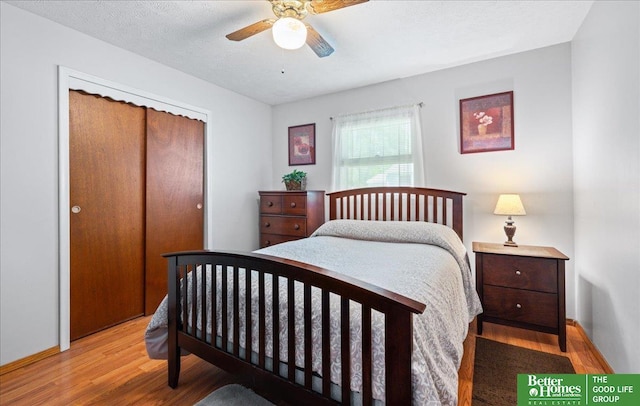 6070 Buckingham Ave, Omaha, NE 68117 - bedroom featuring light wood-type flooring, a closet, and a ceiling fan