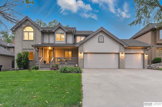 16712 V St, Omaha, NE 68135 - traditional-style home featuring driveway, a porch, brick siding, a front yard, and a garage
