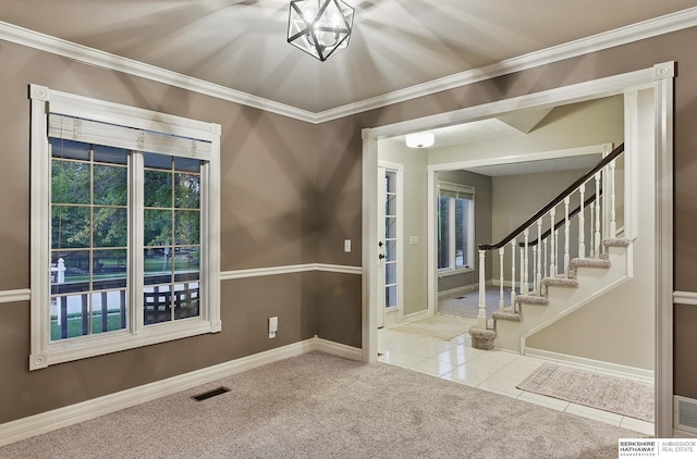 16712 V St, Omaha, NE 68135 - carpeted foyer featuring baseboards, ornamental molding, stairway, and tile patterned floors