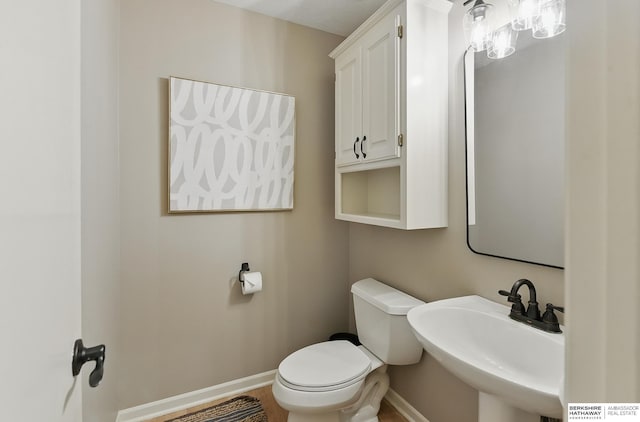 16712 V St, Omaha, NE 68135 - half bath featuring baseboards, a sink, and toilet