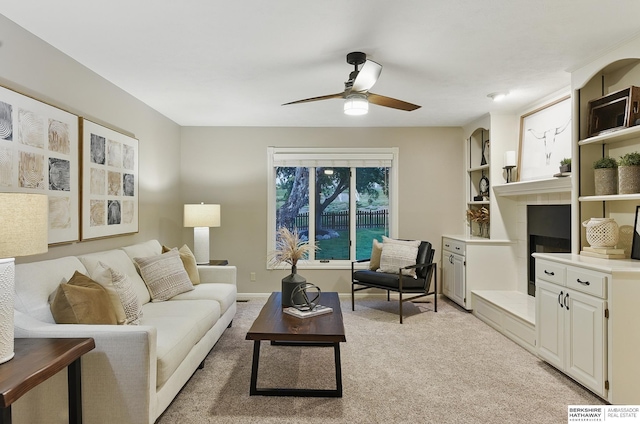 16712 V St, Omaha, NE 68135 - living room featuring a ceiling fan, light carpet, and built in shelves